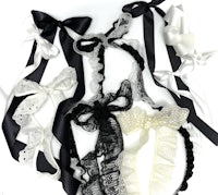 black and white bows and ribbons on a white background