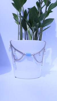 a silver bracelet with a blue stone on it