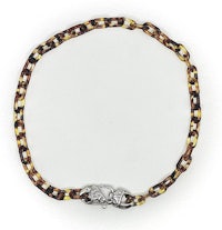 a bracelet with a silver clasp and a tortoise shell